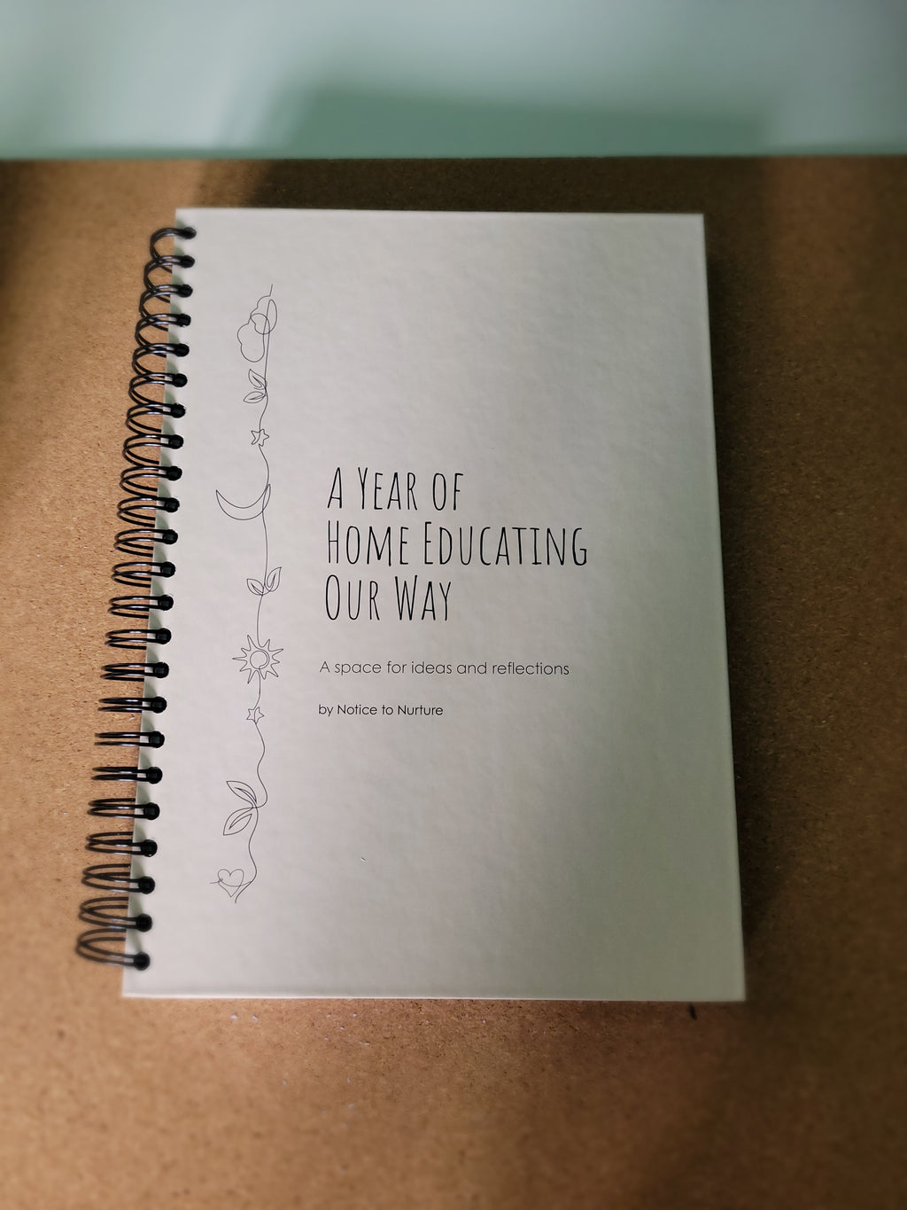 Notebook with text on a brown surface