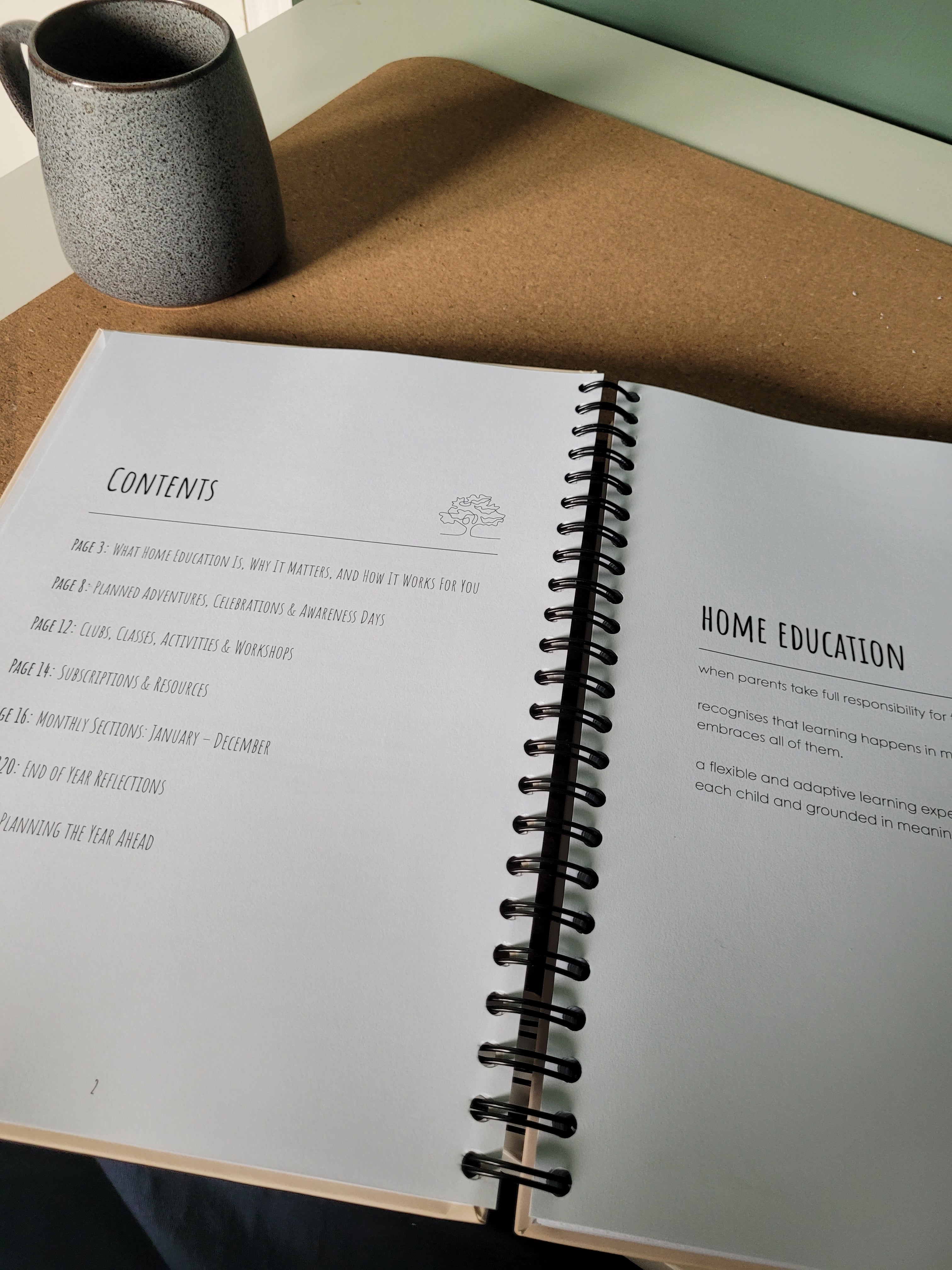 Open spiral-bound book with text on a textured surface