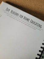 Notebook with text on a cork surface