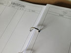 Open ring binder on a cork surface