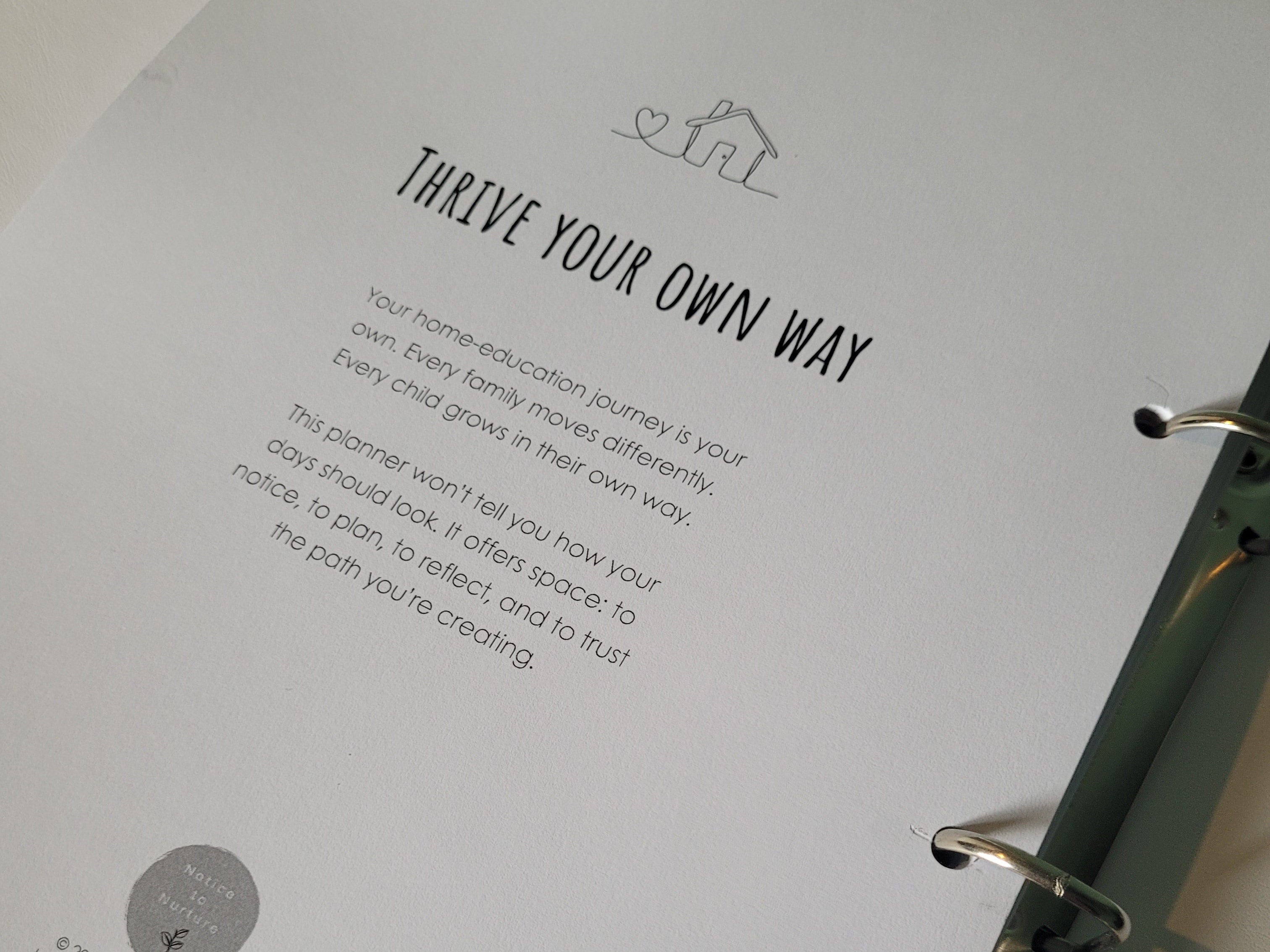 Sheet from a planner with text about home education and a logo